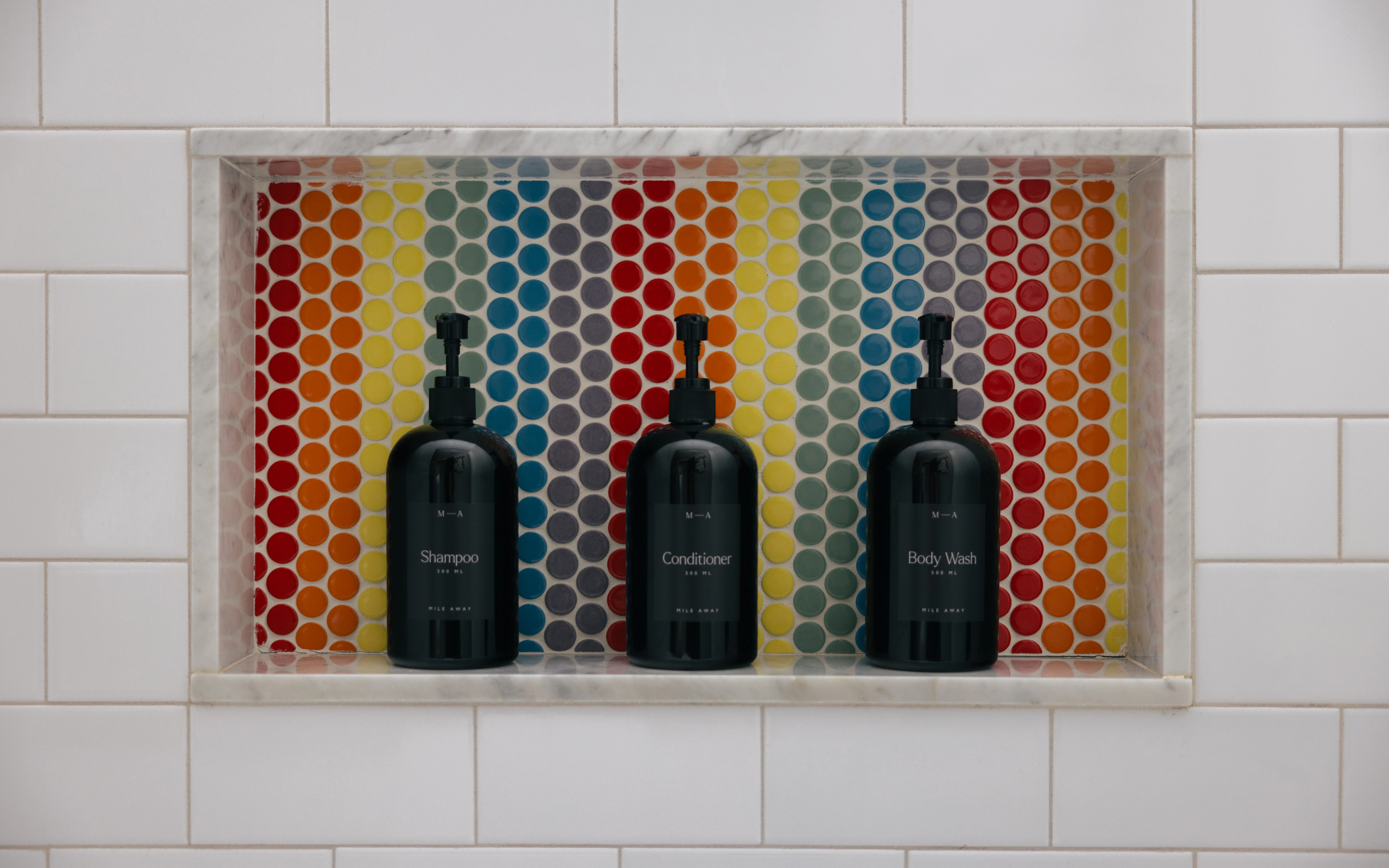 Kids bathroom first angle with playful tile details and bright modern fixtures